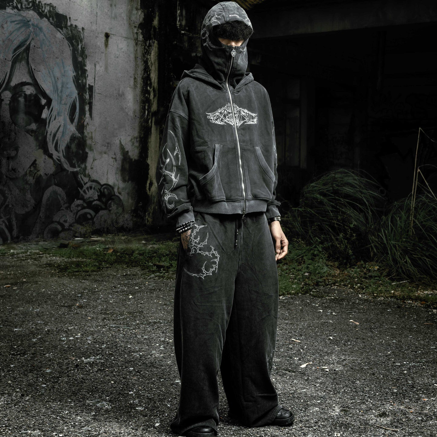 Oversized stonewashed black flared sweatpants and Shroud zip up hoodie oversized cropped embroidered tribal chest graphic embroidery tribal gothic graphic — EXPND