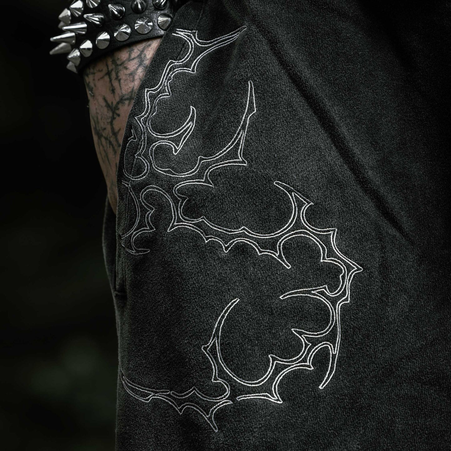 Oversized washed black flared sweatpants embroidery tribal gothic graphic — EXPND