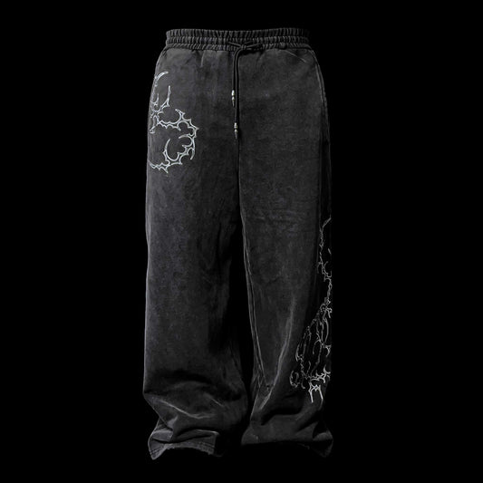 Oversized washed black flared sweatpants embroidery tribal gothic graphic — EXPND